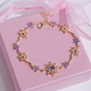 Gold Toned Tangled purple gemstone  sunburst symbol bracelet